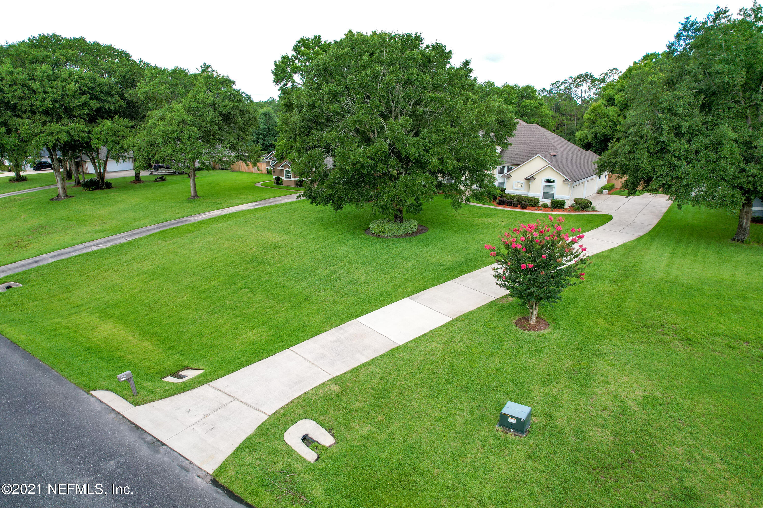 1006 Cactus Cut Road Middleburg, FL 32068 - Photo 54 of 69 a view of a backyard with a garden