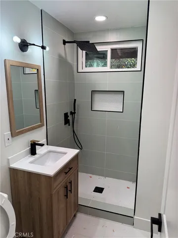 a view of a house with a wooden fence