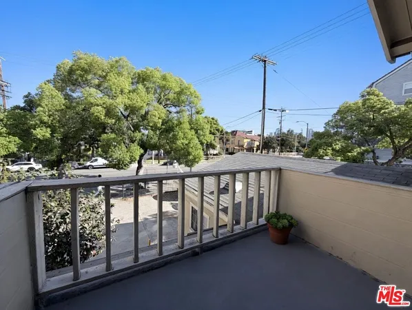 a view of a balcony with furniture