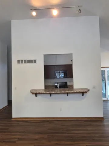 a room with a table and a fireplace