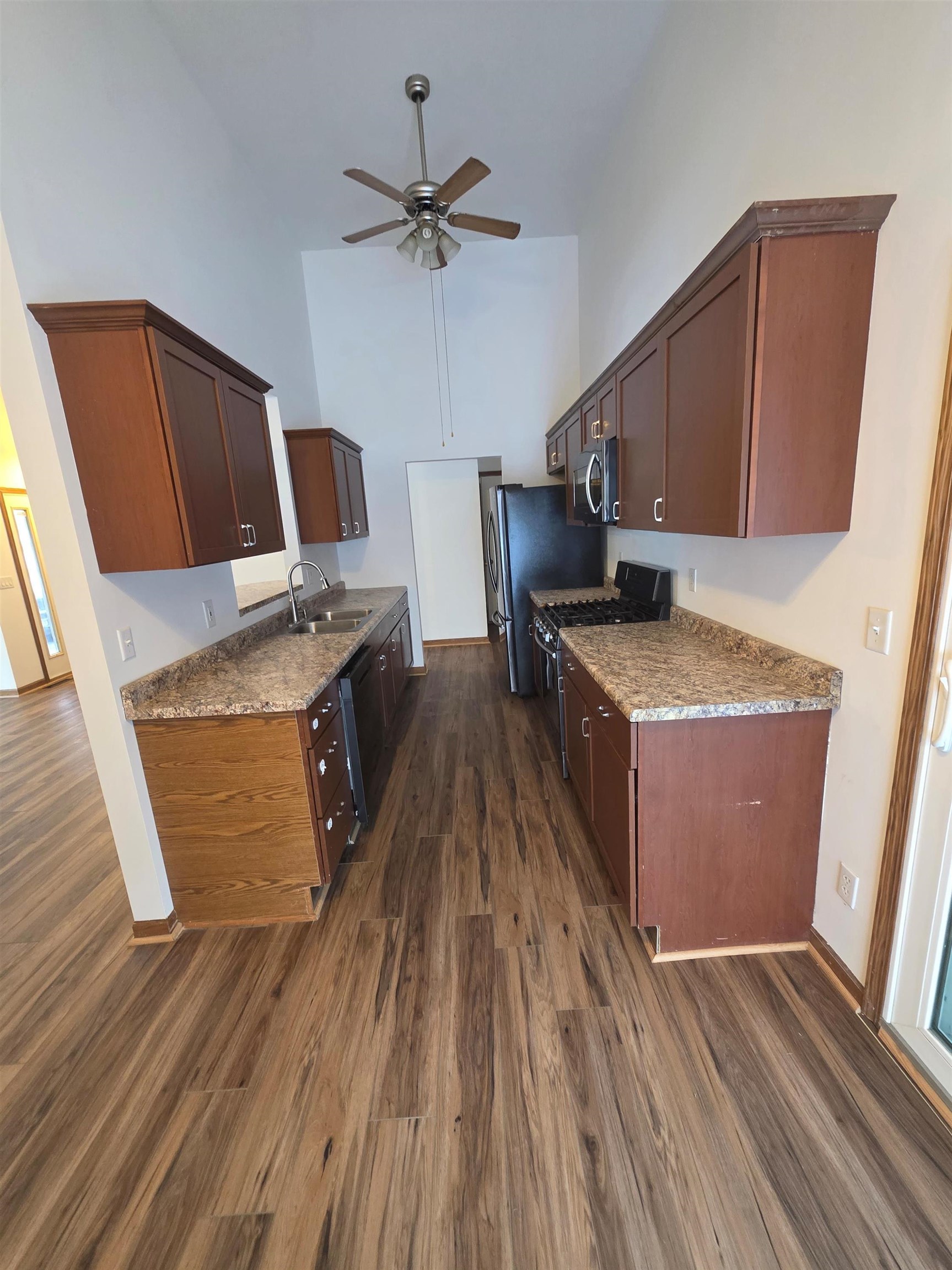 205 Gables Drive Southwest Poplar Grove, IL 61065 - Photo 6 of 33 a kitchen with granite countertop a sink appliances and cabinets