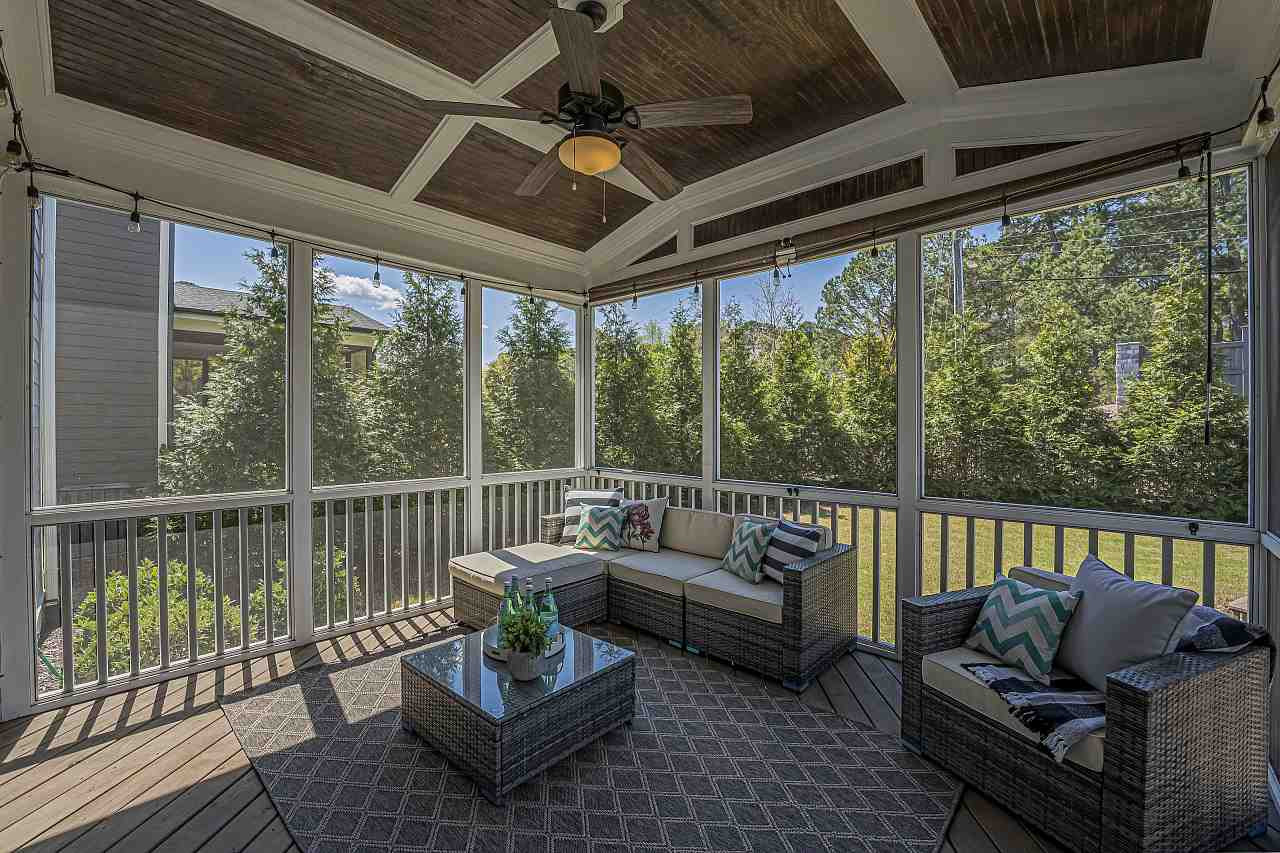 7605 Stonehenge Farm Lane Raleigh, NC 27613 - Photo 29 of 30 Beautiful screened in porch that overlooks a completely fenced in backyard complete with a stone patio and stone fireplace Screened in porch