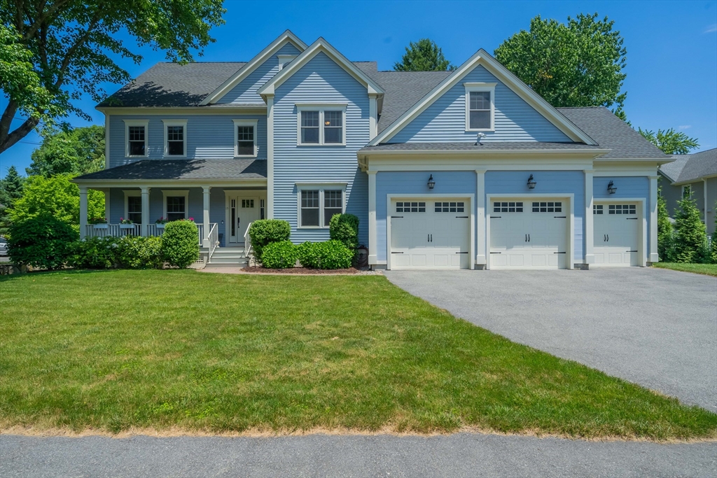 15 Hickory Street Lexington, MA 02421 - Photo 1 of 42 a front view of a house with a yard