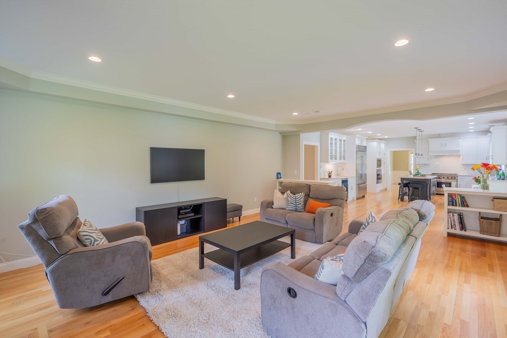 15 Hickory Street Lexington, MA 02421 - Photo 20 of 42 a living room with furniture and a flat screen tv