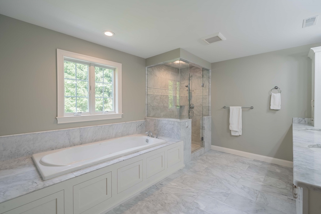 15 Hickory Street Lexington, MA 02421 - Photo 27 of 42 a spacious bathroom with a bathtub and a sink