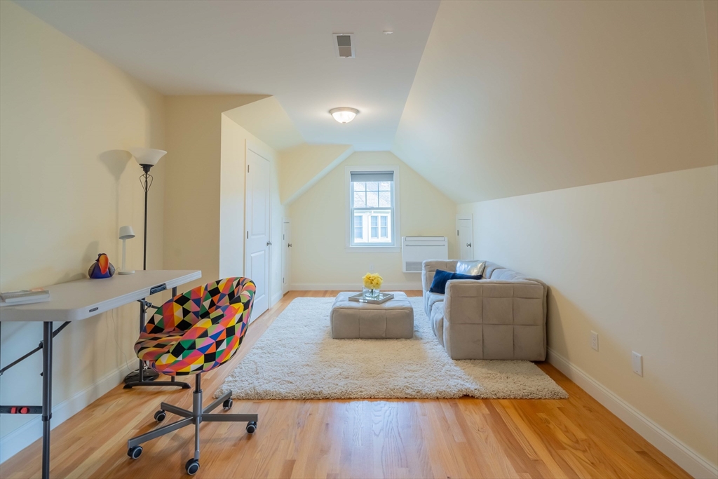 15 Hickory Street Lexington, MA 02421 - Photo 33 of 42 a living room with furniture and a wooden floor