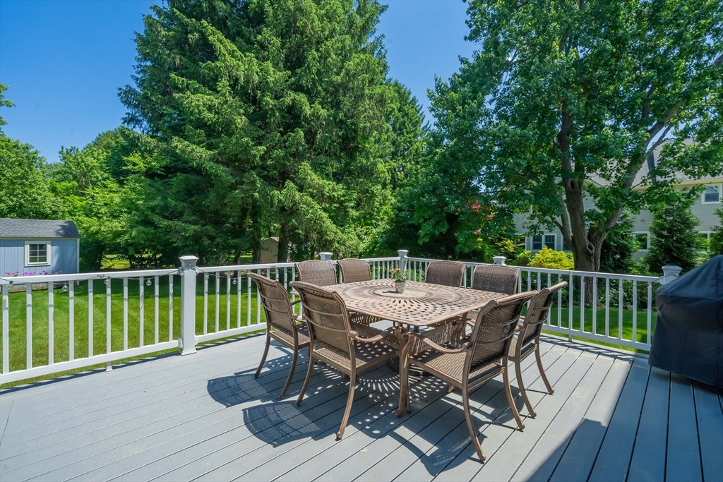 15 Hickory Street Lexington, MA 02421 - Photo 41 of 42 a view of a deck with furniture and trees
