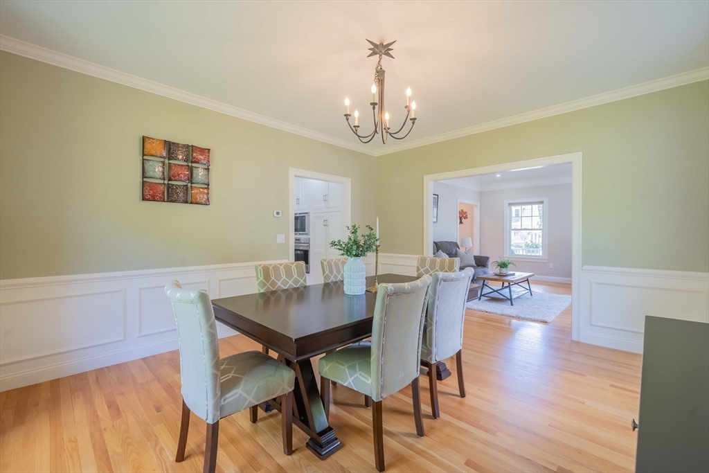 15 Hickory Street Lexington, MA 02421 - Photo 9 of 42 a view of a dining room with furniture wooden floor and a chandelier