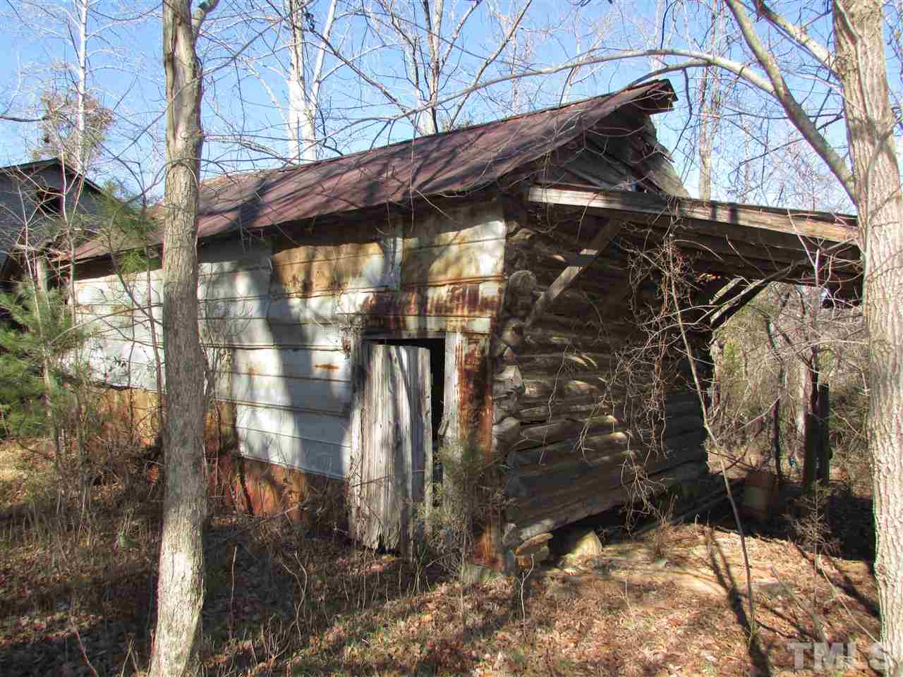0 St Paul Church Road Roxboro, NC 27574 - Photo 3 of 22 Old Tobacco Barn with a shed on it sits in font of the pack house.