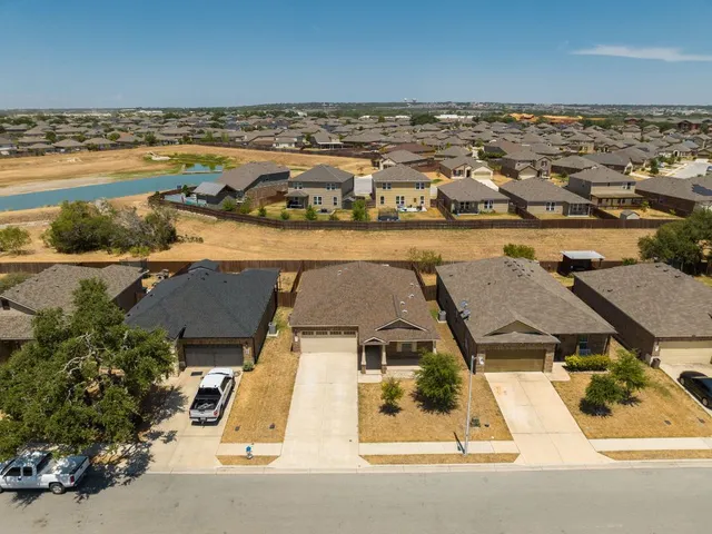 an aerial view of a house with a ocean view