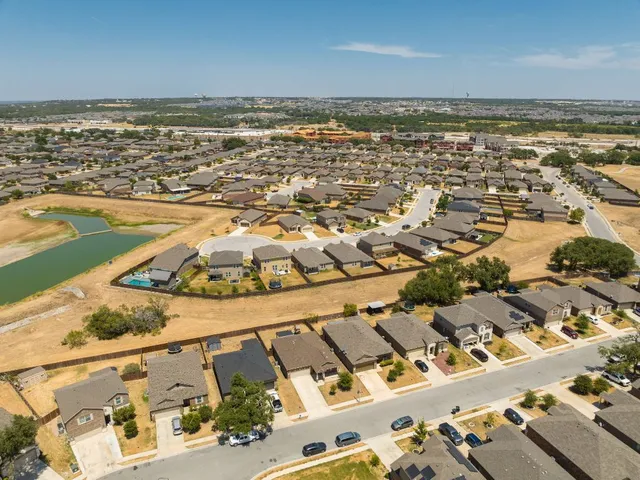 an aerial view of residential building and ocean