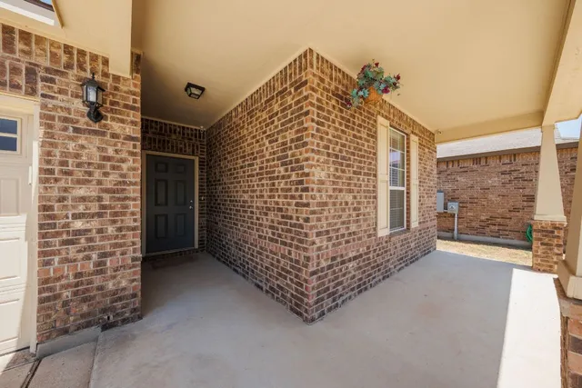 a view of entryway with brick walls
