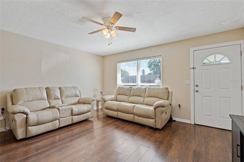 7651 Montague Loop New Port Richey, FL 34655 - Photo 12 of 26 a living room with furniture and a window
