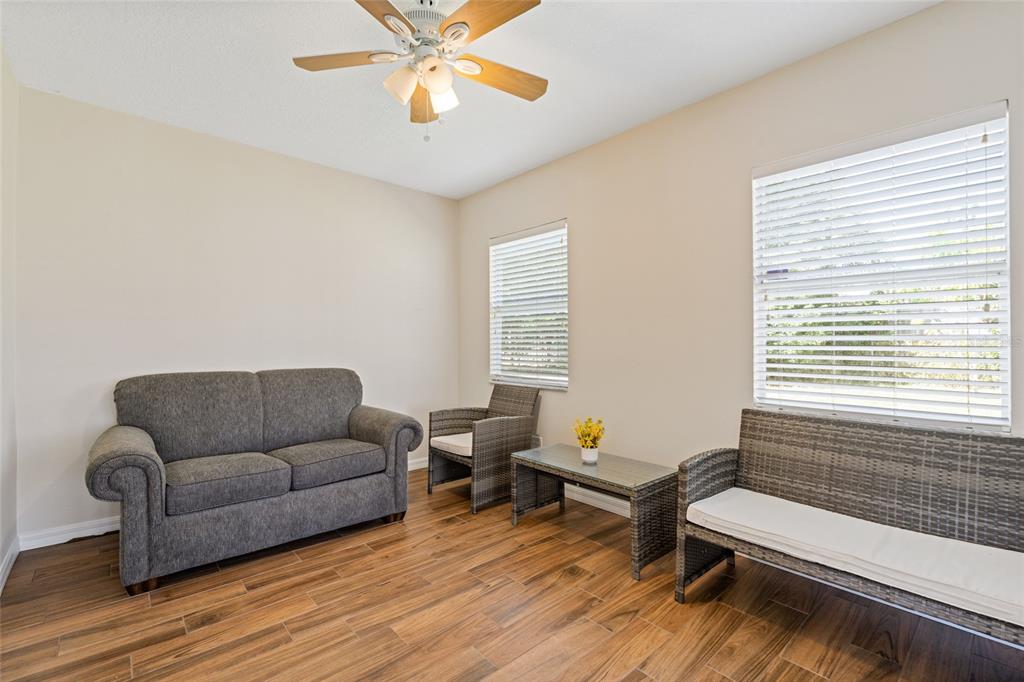 7651 Montague Loop New Port Richey, FL 34655 - Photo 13 of 26 a living room with furniture and a wooden floor