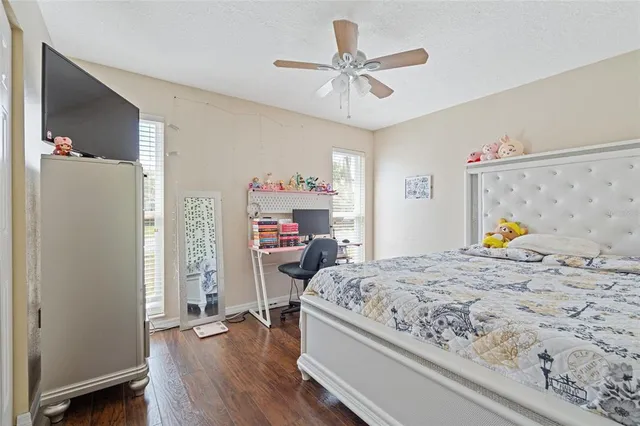 a bedroom that has a bed and a chandelier