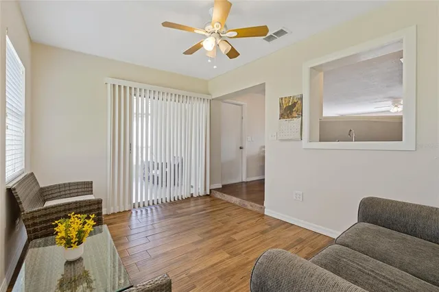 a bedroom with furniture and wooden floor