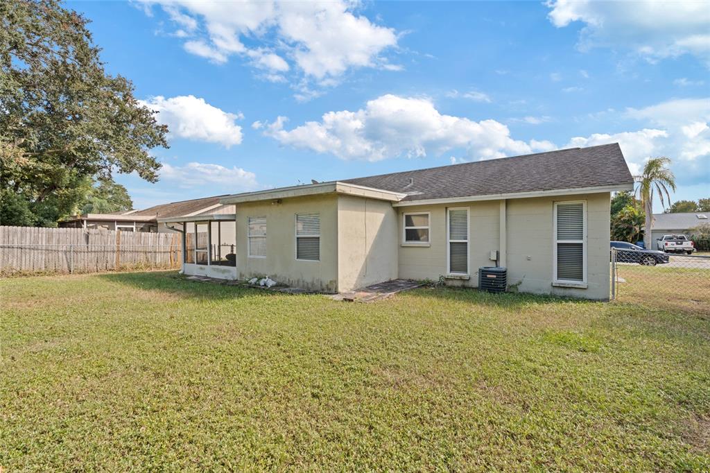 7651 Montague Loop New Port Richey, FL 34655 - Photo 7 of 26 a view of a yard in front of a house