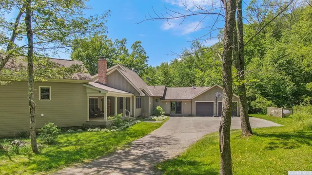 front view of a house and a yard