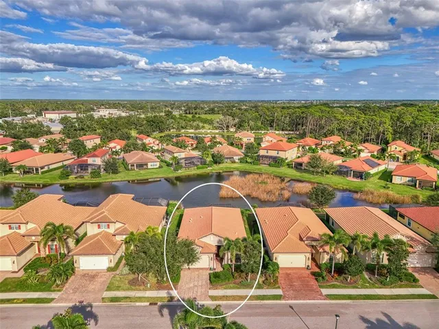 a front view of a house with a yard and a garage