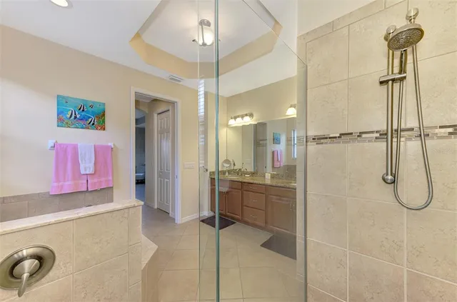 a bedroom with two beds and a large window