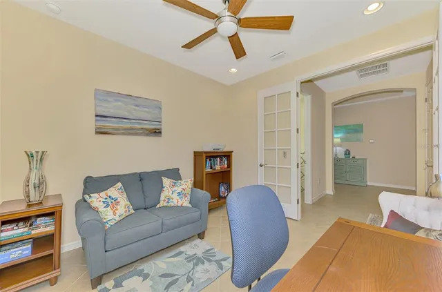 an aerial view of residential houses with outdoor space and lake view