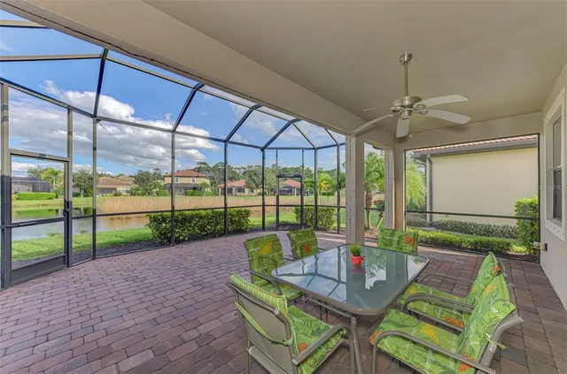 an aerial view of residential houses with outdoor space and ocean view