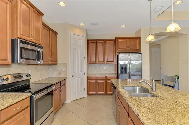 a living room with furniture a flat screen tv and a large window