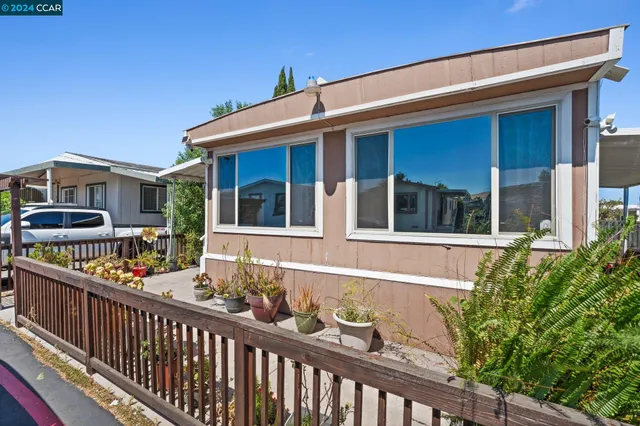 a front view of a house with glass windows