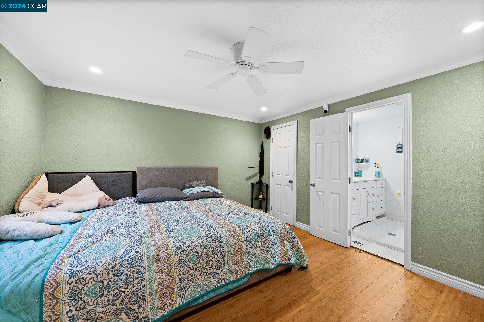 55 Pacifica Avenue, Unit 51 Bay Point, CA 94565 - Photo 20 of 35 a bedroom with a bed and a chandelier