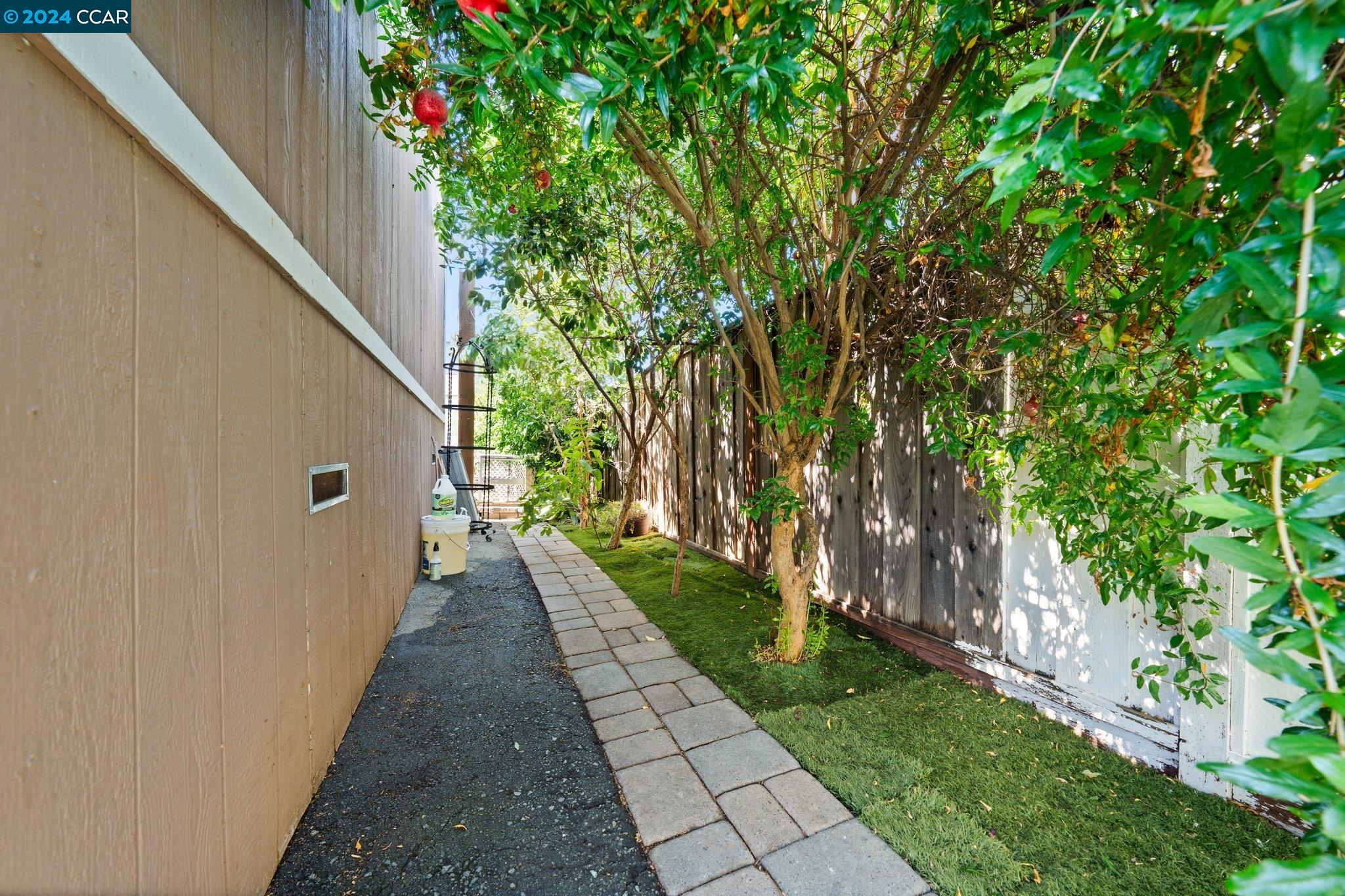 55 Pacifica Avenue, Unit 51 Bay Point, CA 94565 - Photo 24 of 35 a view of a pathway of a house with a yard