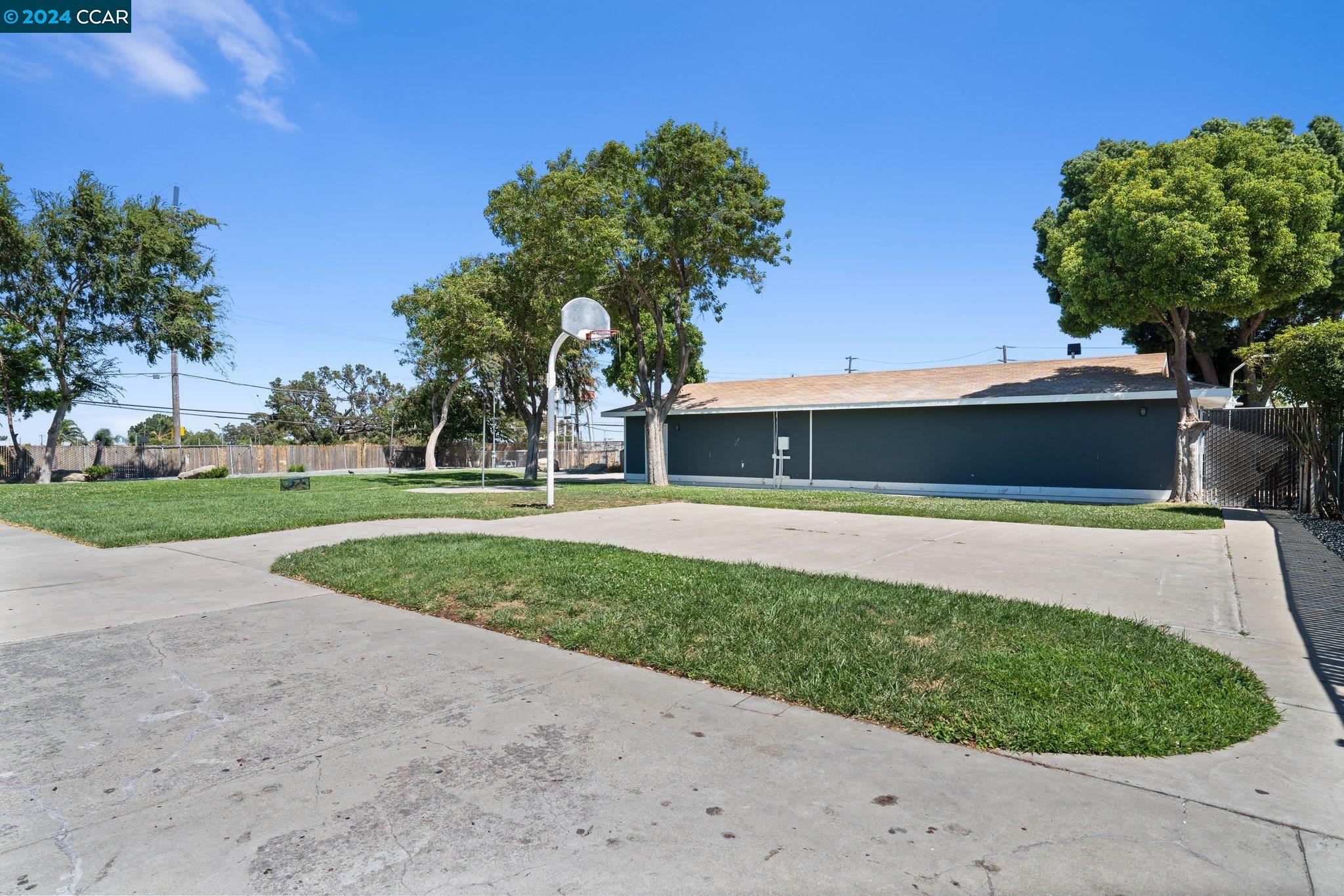 55 Pacifica Avenue, Unit 51 Bay Point, CA 94565 - Photo 32 of 35 a front view of a house with a yard