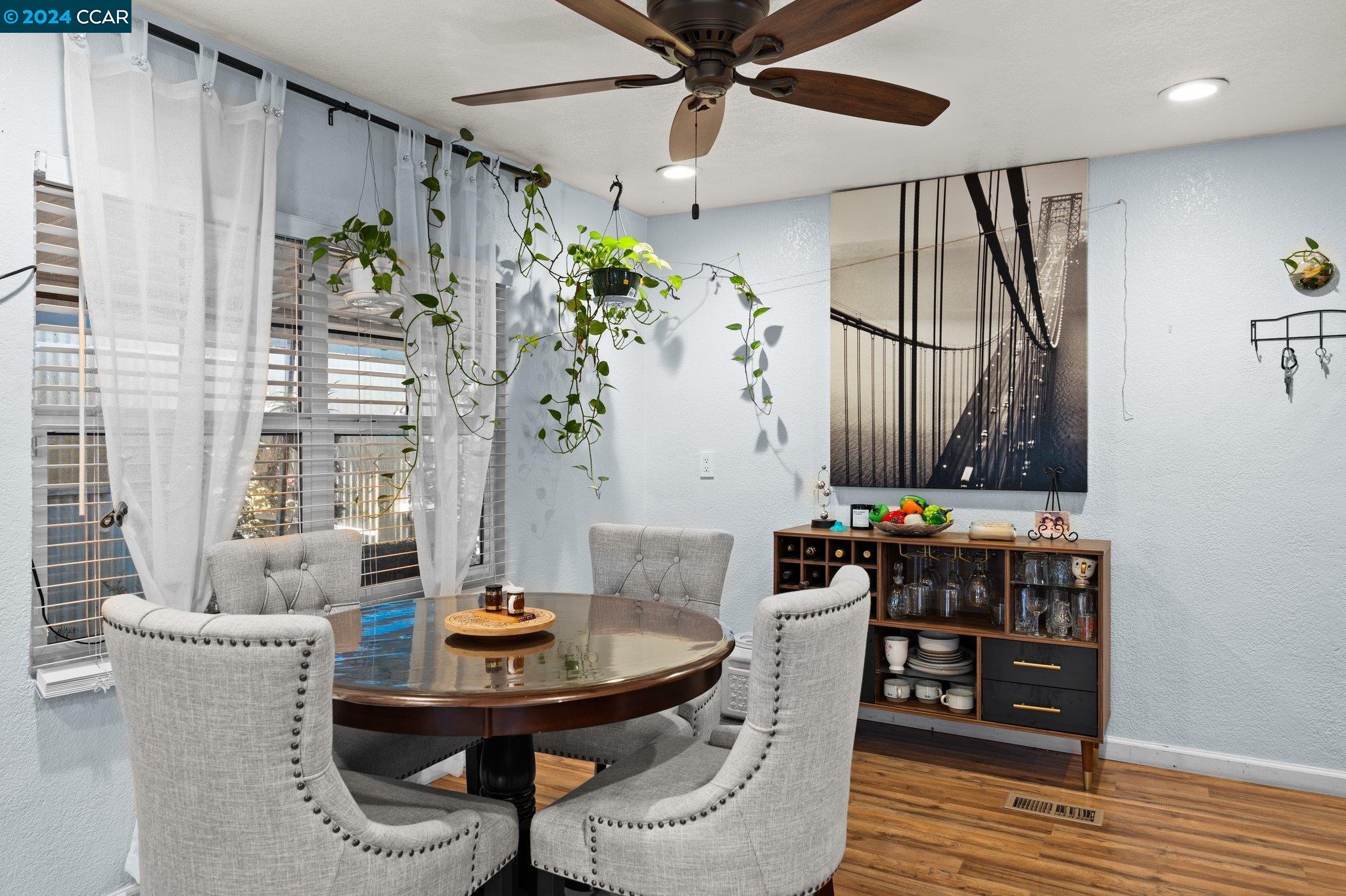 55 Pacifica Avenue, Unit 51 Bay Point, CA 94565 - Photo 5 of 35 a view of a dining room with furniture and wooden floor