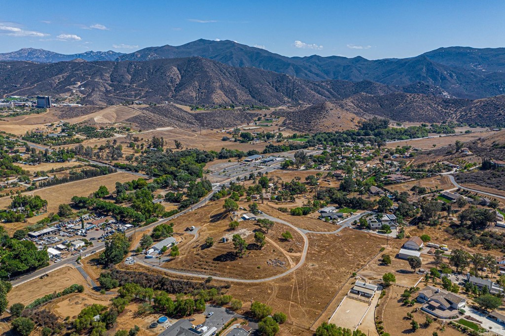 an aerial view of residential house and sandy dunes