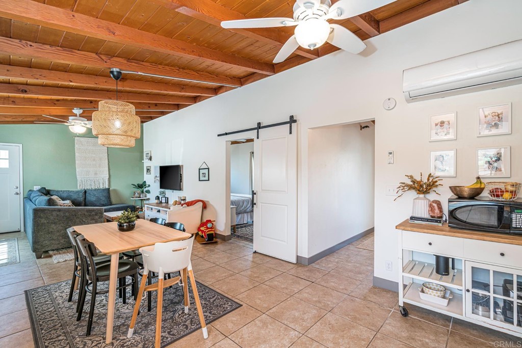 2030 Harbison Canyon Road El Cajon, CA 92019 - Photo 12 of 66 a dining room with furniture and a chandelier