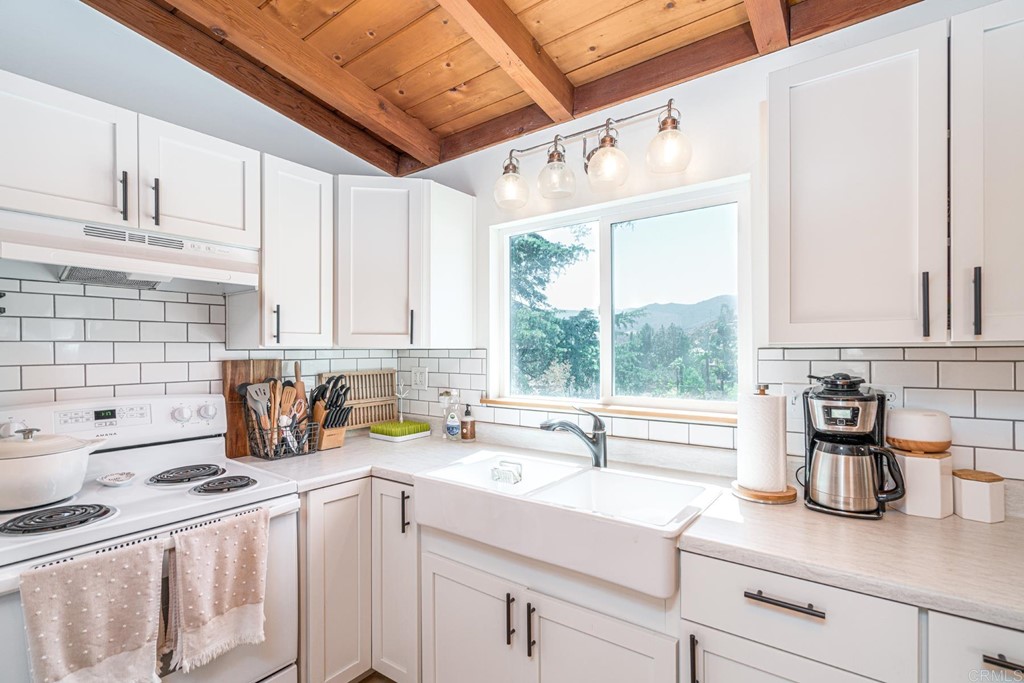 2030 Harbison Canyon Road El Cajon, CA 92019 - Photo 13 of 66 a kitchen with a sink a counter top space and cabinets