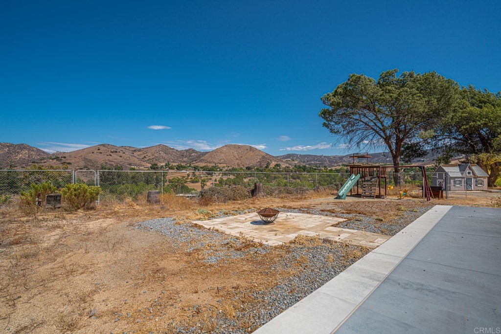 2030 Harbison Canyon Road El Cajon, CA 92019 - Photo 21 of 66 a view of a lake with a mountain in the background