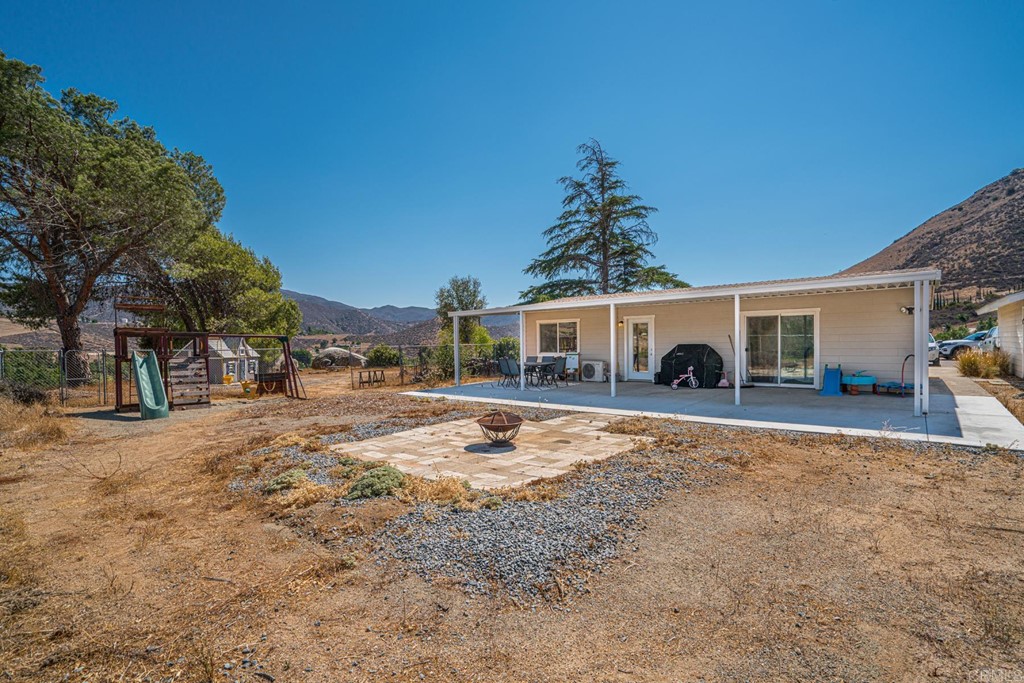 2030 Harbison Canyon Road El Cajon, CA 92019 - Photo 22 of 66 a front view of a house with a yard
