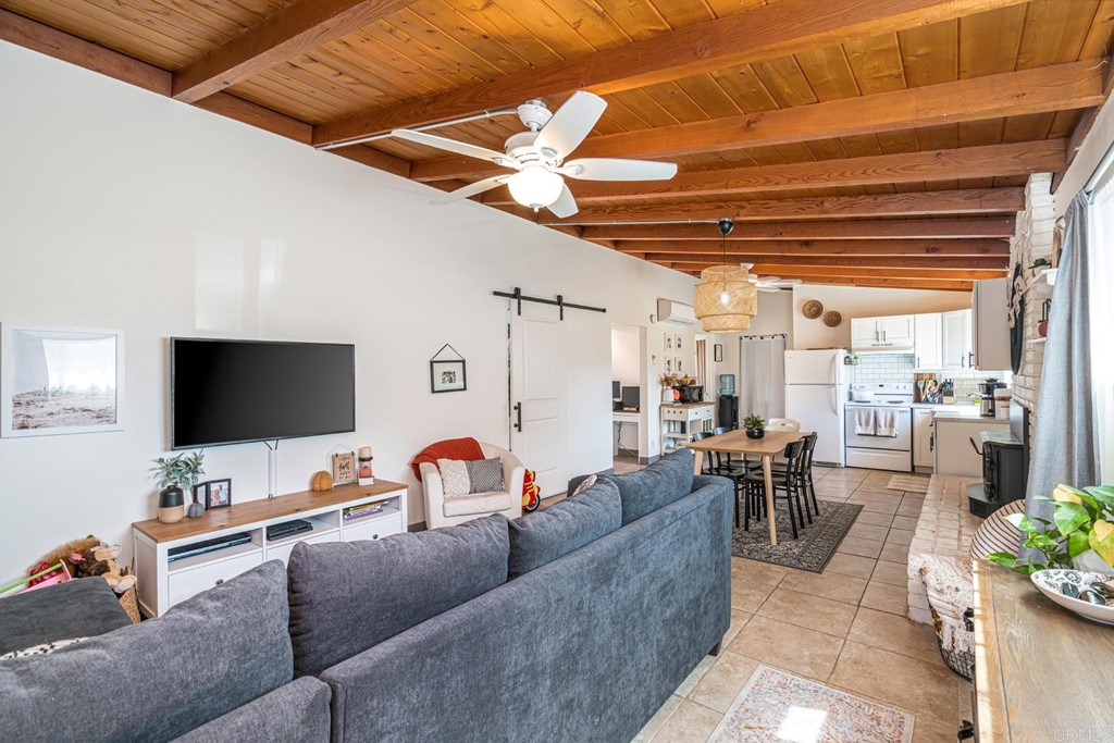 2030 Harbison Canyon Road El Cajon, CA 92019 - Photo 4 of 66 a living room with furniture and a flat screen tv