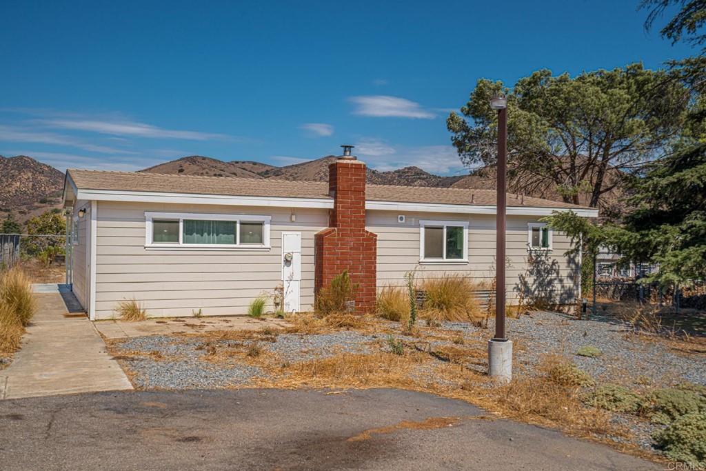 2030 Harbison Canyon Road El Cajon, CA 92019 - Photo 31 of 66 a front view of a house with a yard