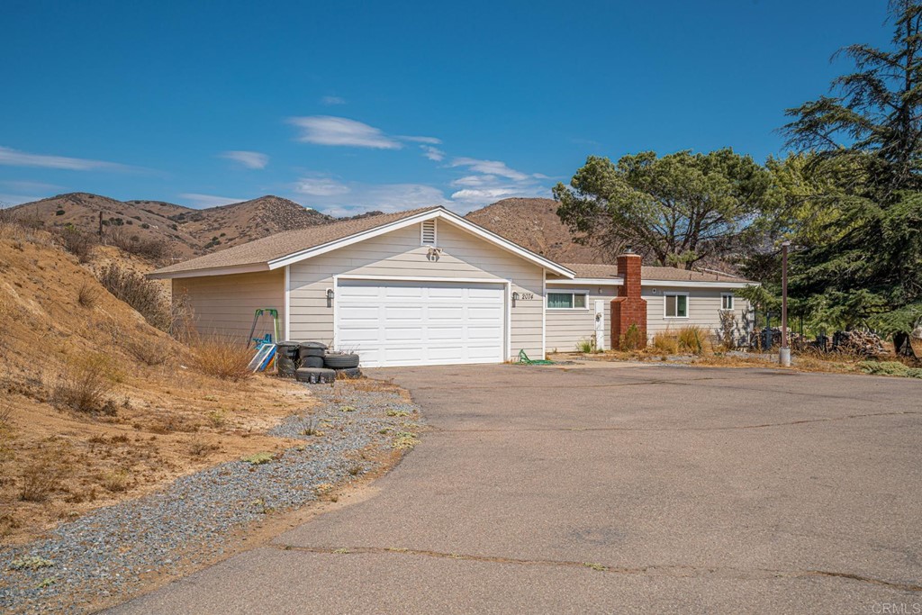 2030 Harbison Canyon Road El Cajon, CA 92019 - Photo 32 of 66 a view of a house with a snow in the background