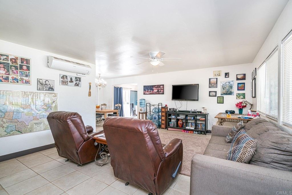 2030 Harbison Canyon Road El Cajon, CA 92019 - Photo 38 of 66 a living room with furniture and a flat screen tv