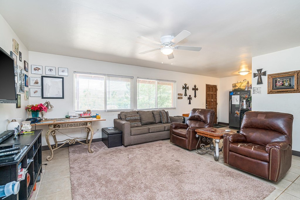 2030 Harbison Canyon Road El Cajon, CA 92019 - Photo 39 of 66 a living room with furniture and a large window
