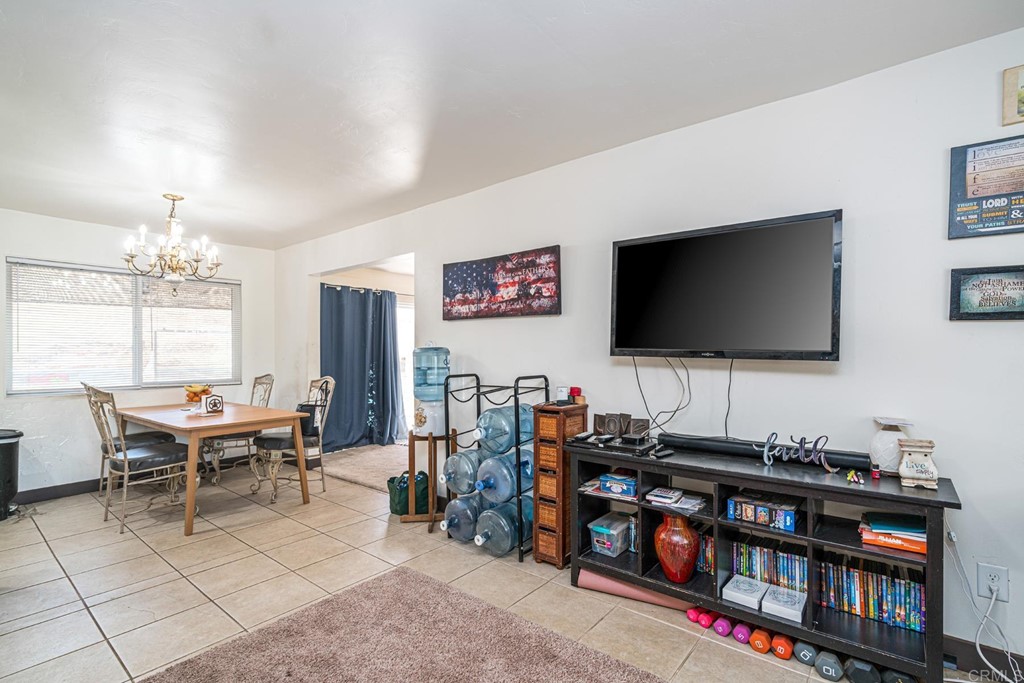 2030 Harbison Canyon Road El Cajon, CA 92019 - Photo 40 of 66 a living room with furniture and a flat screen tv