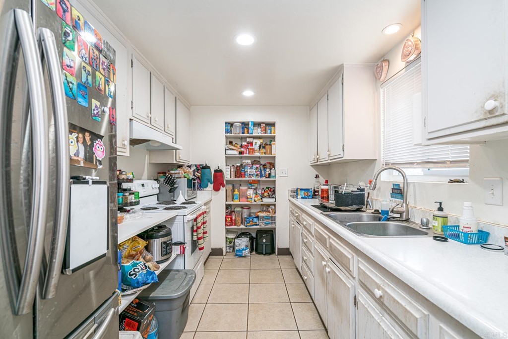 2030 Harbison Canyon Road El Cajon, CA 92019 - Photo 42 of 66 a kitchen with stainless steel appliances and cabinets