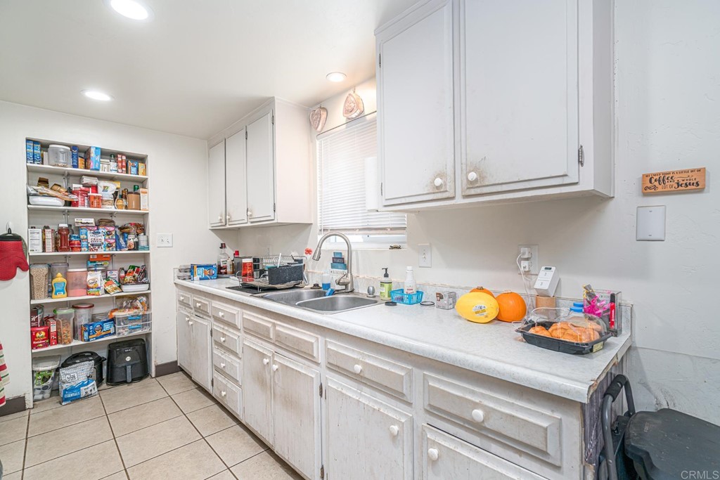 2030 Harbison Canyon Road El Cajon, CA 92019 - Photo 44 of 66 a kitchen with stainless steel appliances granite countertop a sink and cabinets