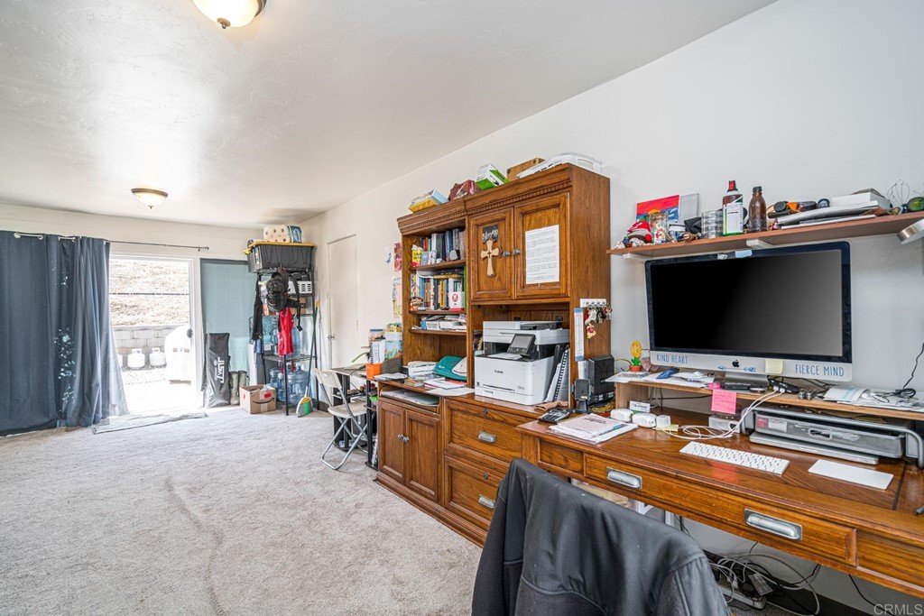 2030 Harbison Canyon Road El Cajon, CA 92019 - Photo 46 of 66 a room with furniture a flat screen tv and a window