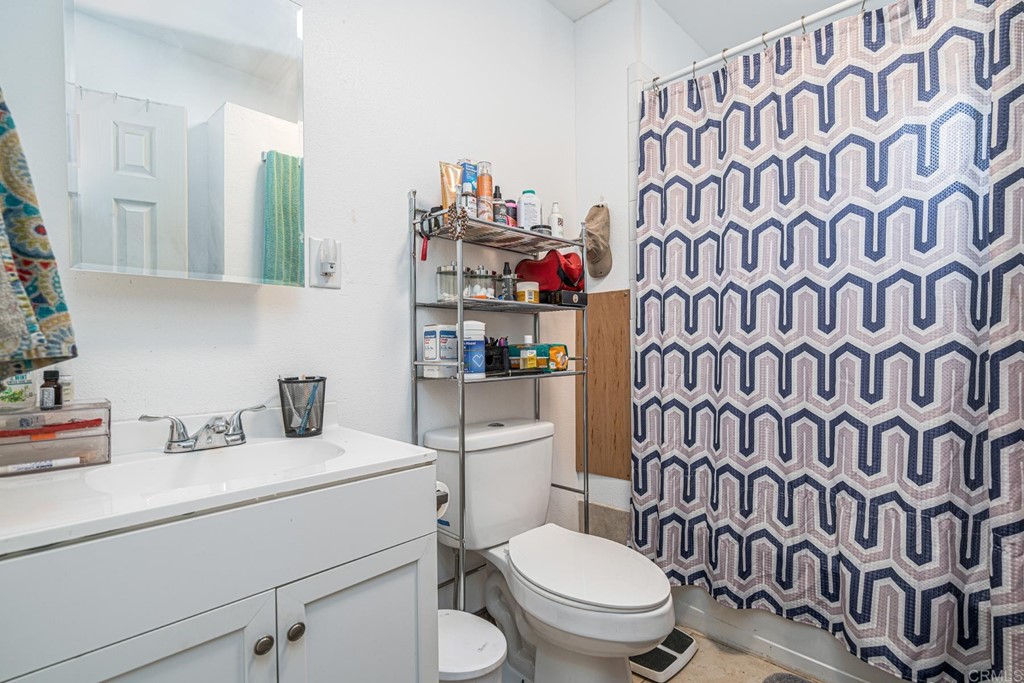2030 Harbison Canyon Road El Cajon, CA 92019 - Photo 47 of 66 a bathroom with a toilet and a sink