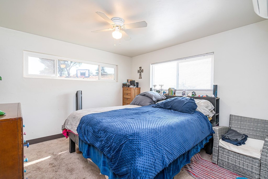 2030 Harbison Canyon Road El Cajon, CA 92019 - Photo 50 of 66 a bedroom with a bed and window