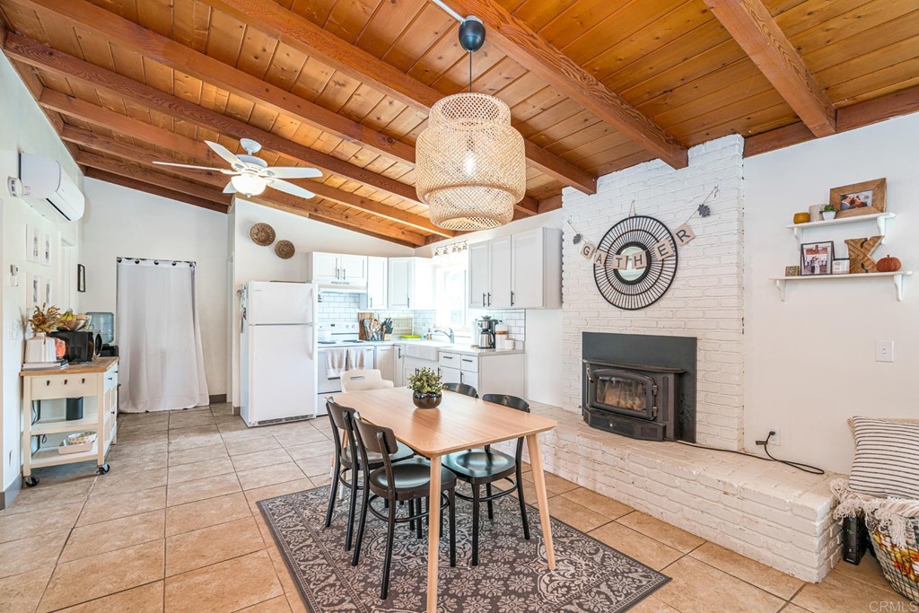 2030 Harbison Canyon Road El Cajon, CA 92019 - Photo 6 of 66 a view of a dining room with furniture and a fireplace