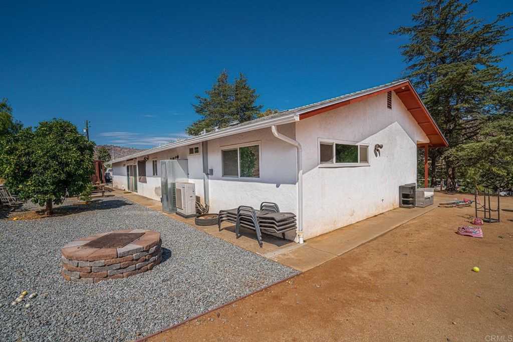 2030 Harbison Canyon Road El Cajon, CA 92019 - Photo 55 of 66 a backyard of a house with table and chairs with plants
